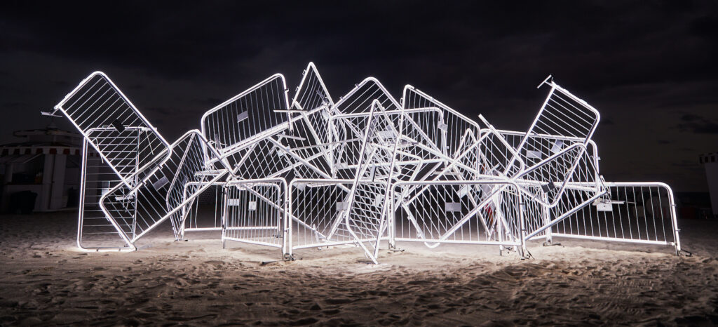 A commission by No Vacancy: Antonia Wright in collaboration with Ruben Millares, 2022, 25 steel barricades, LED lights, steel zip ties, 40 x 10 x 10 ft, Installation image from the Faena Hotel Miami Beach