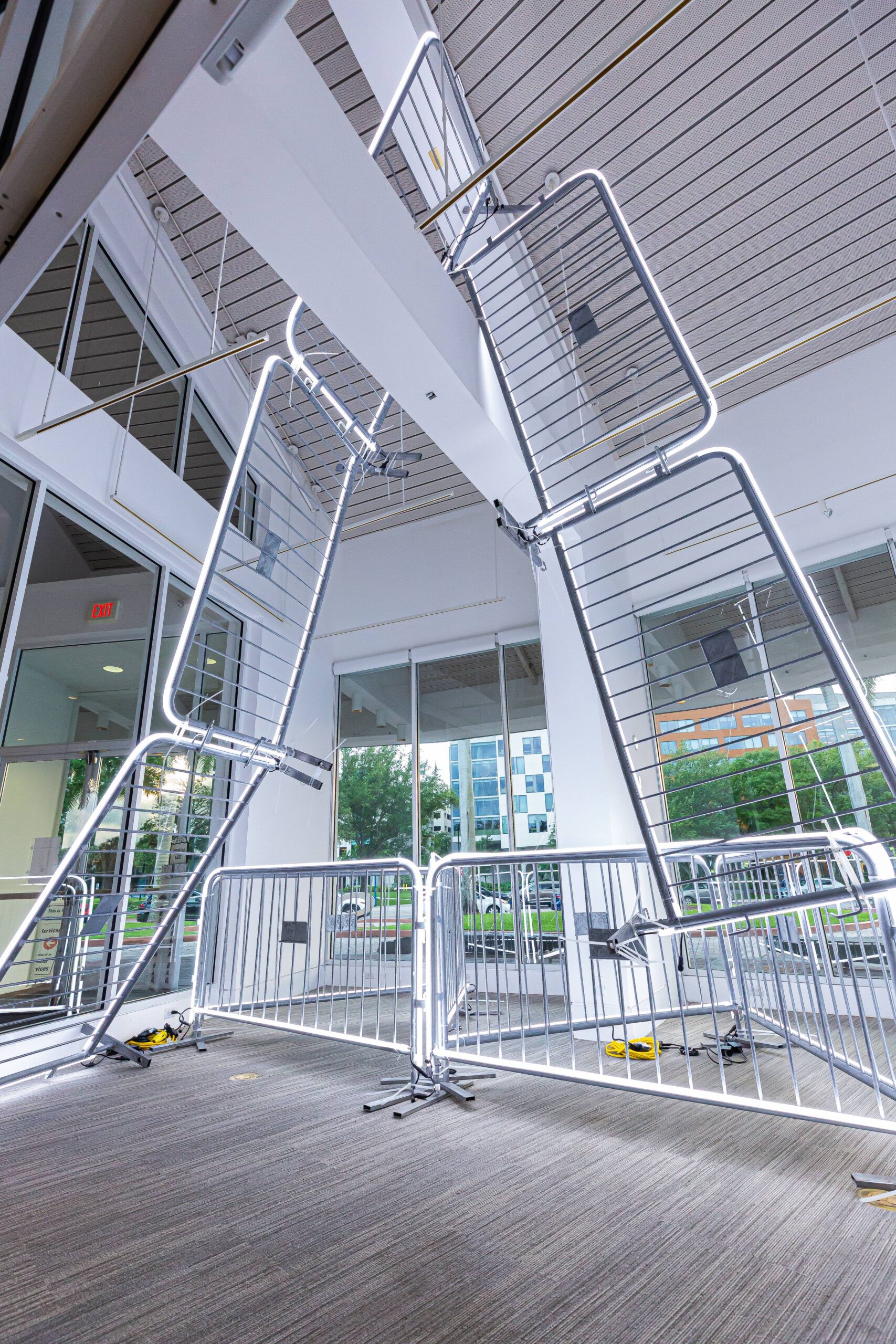 Antonia Wright and Ruben Millares,What Goes Up, Must Come Down, 2024 Steel barricades, LED lights, zip ties Dimensions variable Installation from the Lowe Art Museum